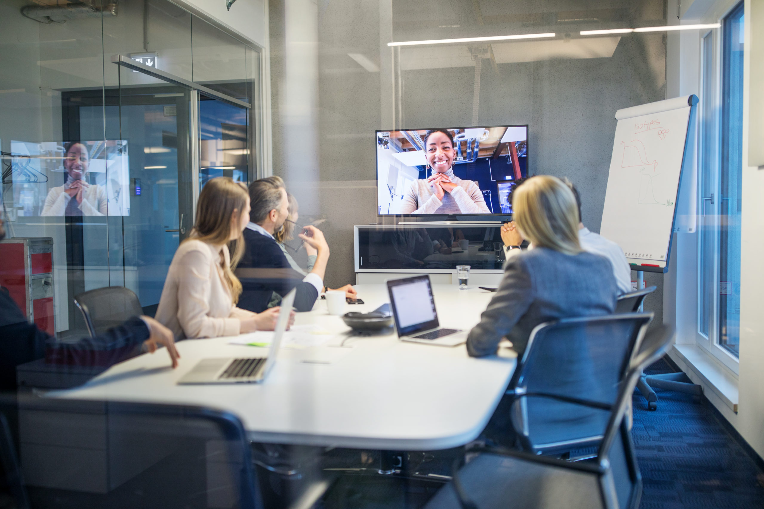 Businesswoman having video conference meeting with team